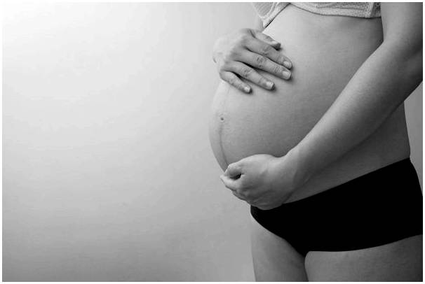 Низкий живот при беременности: что это значит?
